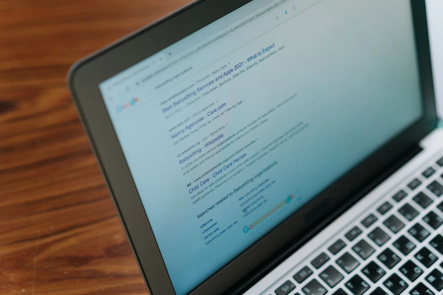 Laptop showing search engine results while auditing a competitor's SEO